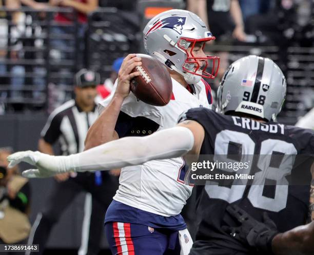 Defensive end Maxx Crosby of the Las Vegas Raiders sacks quarterback Mac Jones of the New England Patriots in the end zone for a safety in the fourth...