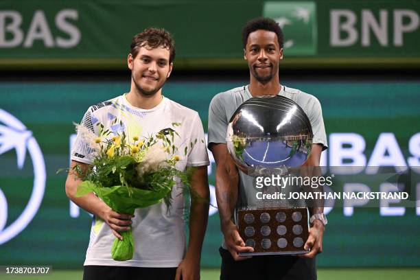 Winner France's Gael Monfils poses with second placed Russia's Pavel Kotov after their the men's singles final match of the ATP Nordic Open tennis...