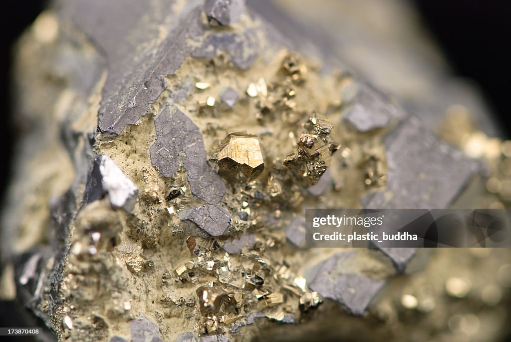 Macro picture of a raw golden nugget found on a mine