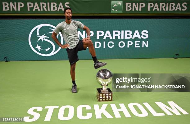 France's Gael Monfils poses with his trophy after winning against Russia's Pavel Kotov during the men's singles final match of the ATP Nordic Open...