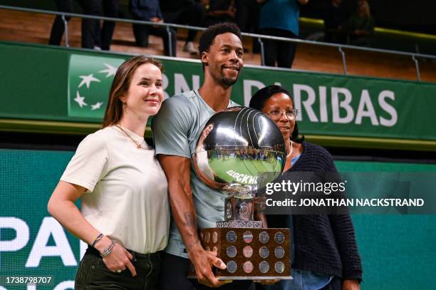 France's Gael Monfils celebrates with his mother Sylvette Cartesse and his wife, Ukrainian tennis player Elina Svitolina after winning the men's...