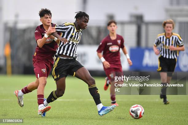 Benit Borasio of Juventus U16 is challenged during the match between Juventus U16 and Torino U16 at Juventus Center Vinovo on October 22, 2023 in...
