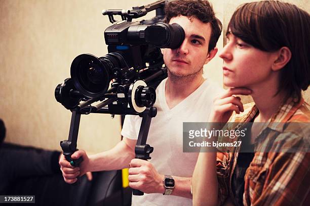director and dp consider a shot - film director stock pictures, royalty-free photos & images