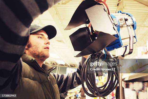 electrician setting light - roadie stock pictures, royalty-free photos & images