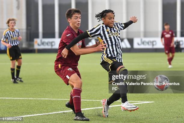 Luis Gabriel Suazo of Juventus U16 is challenged during the match between Juventus U16 and Torino U16 at Juventus Center Vinovo on October 22, 2023...