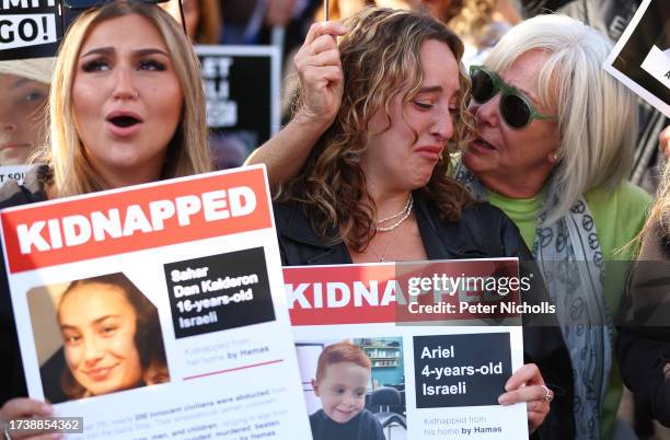 People participate in a 'Bring Them Home' solidarity rally in Trafalgar Square calling for the release of hostages held in Gaza by Hama on October...