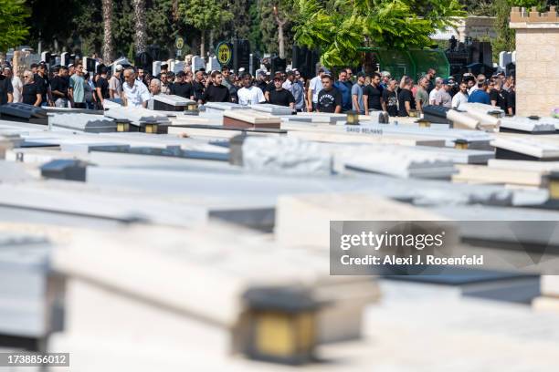 Hundreds of mourners follow the family and body of Naor Hassidim who was killed with his girlfriend Sivan Alkabtas during the attack on kibbutz Kfar...