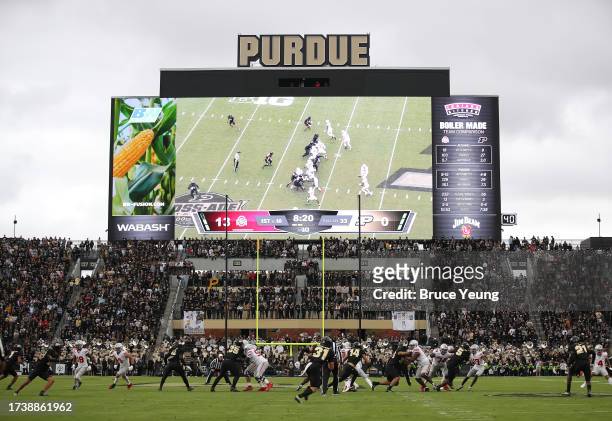 The Buckeyes run an offensive play in the second quarter with the new jumbotron in the background against the Purdue Boilermakers at Ross-Ade Stadium...