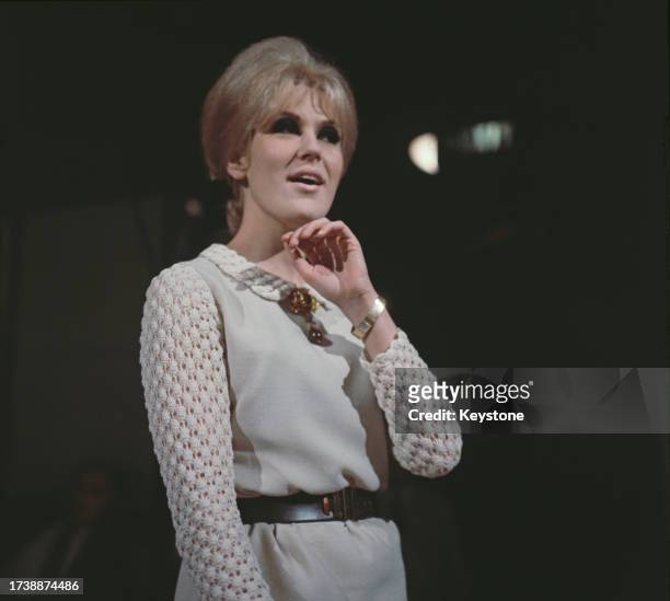 British singer Dusty Springfield during a performance in November 1964.