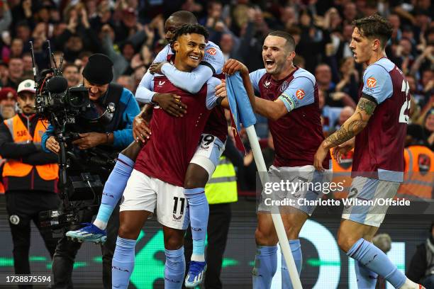 Ollie Watkins of Aston Villa celebrates scoring their 3rd goal with Moussa Diaby, John McGinn and Nicolo Zaniolo during the Premier League match...