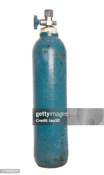 gas cylinder tank with rust spots and peeling blue paint - oxygen cylinder stock pictures, royalty-free photos & images