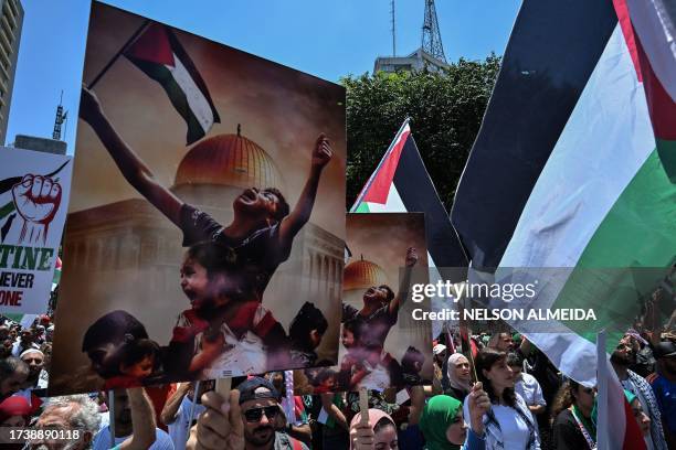 People take part in a demonstration against Israel's military offensive in the Gaza Strip in Sao Paulo, Brazil, on October 22, 2023. Thousands of...