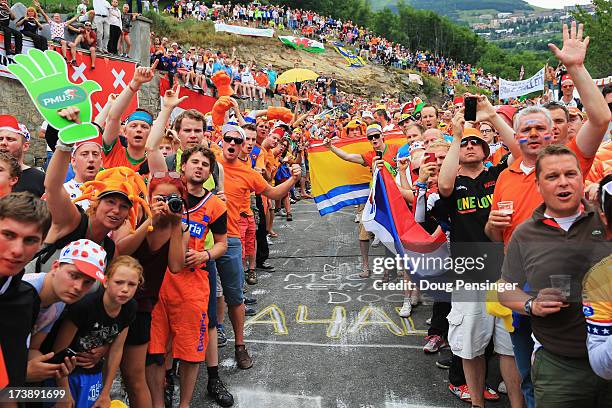 Dutch fans line the road to the top of the Alpe d'Huez during stage eighteen of the 2013 Tour de France, a 172.5KM road stage from Gap to l'Alpe...