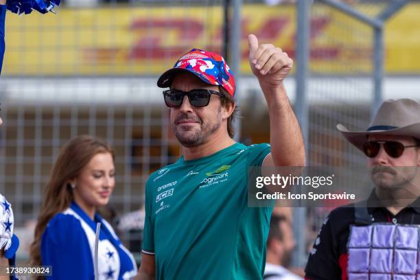 Aston Martin Aramco Cognizant F1 Team driver Fernando Alonso of Spain walks onto the track for the driver parade before the Formula 1 Lenovo United...