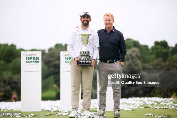 Coach Jamie Gough and Matthieu Pavon of France with the trophy after winning on Day Four of the acciona Open de Espana presented by Madrid at Club de...