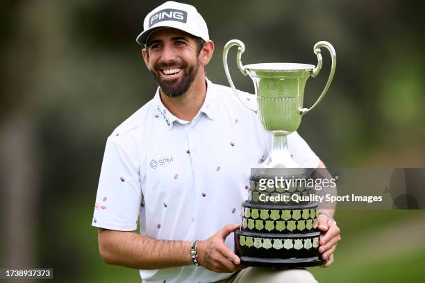 Matthieu Pavon of France poses with the winner's trophy of the acciona Open de Espana on Day Four of the acciona Open de Espana presented by Madrid...