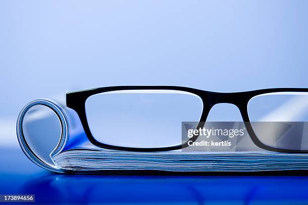 magazine and glasses - glass magazine stock pictures, royalty-free photos & images