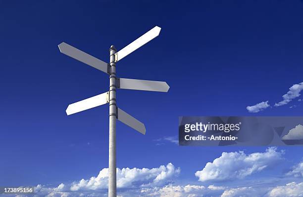 signpost with three blank signs on sky backgrounds - direction stock pictures, royalty-free photos & images