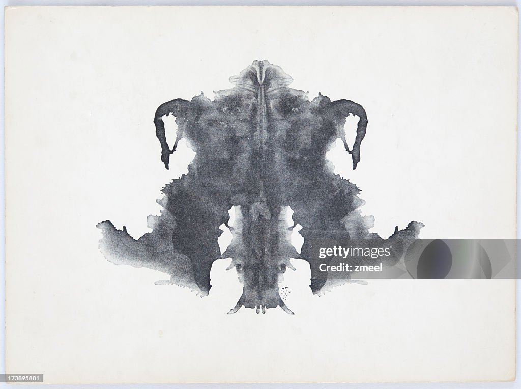 Grey and black Rorschach Ink Blot on a white background