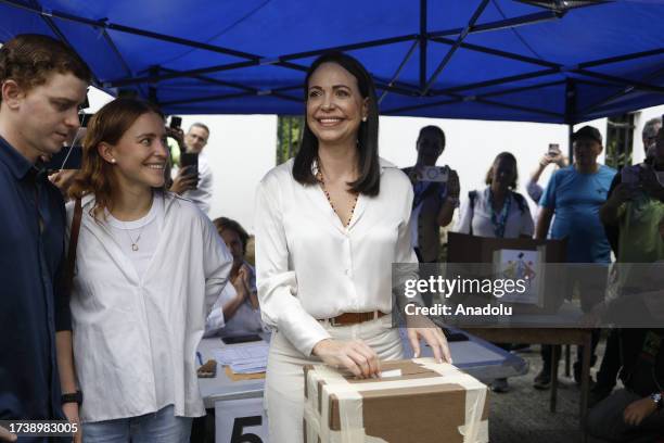 Venezuelan presidential pre-candidate for the opposition Vente Venezuela party, Maria Corina Machado , votes at a polling station during the...