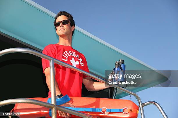 beach lifeguard on tower - lifeguard stock pictures, royalty-free photos & images