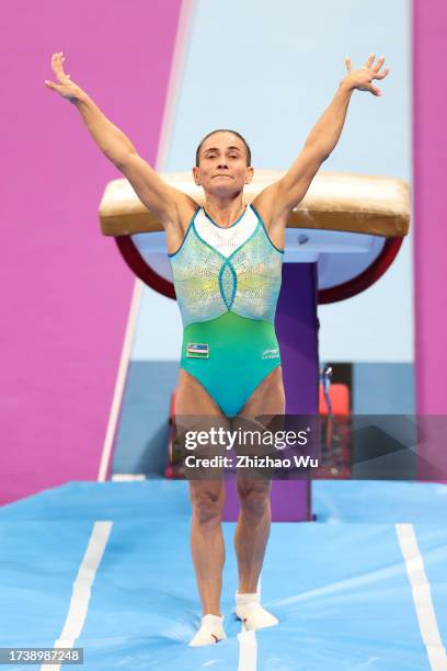 Oksana Chusovitina of Uzbekistan competes during Artistic Gymnastics Women's Vault Final of The 19th Asian Games at Huanglong Sports Centre Gymnasium...