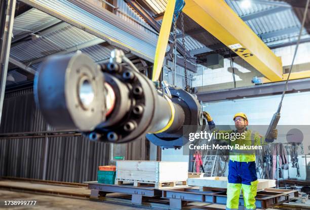engineer craning strut in engineering repair facility - hydraulics stock pictures, royalty-free photos & images