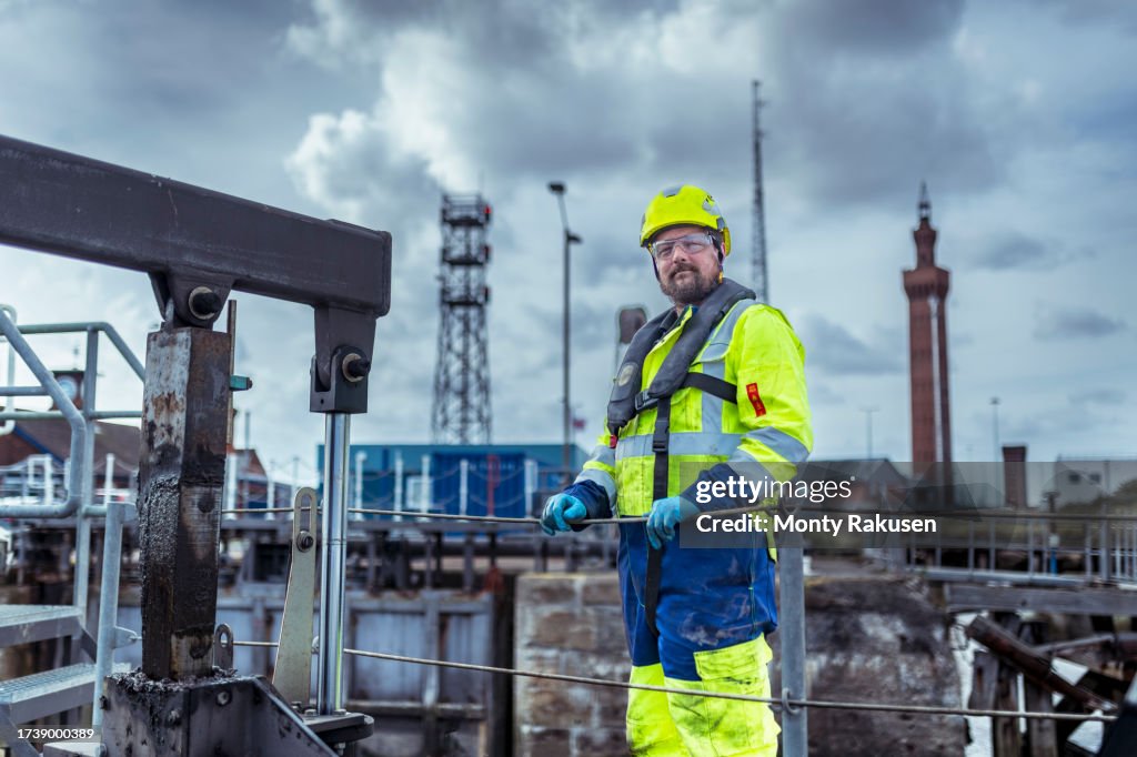 Engineer by lock gates in port