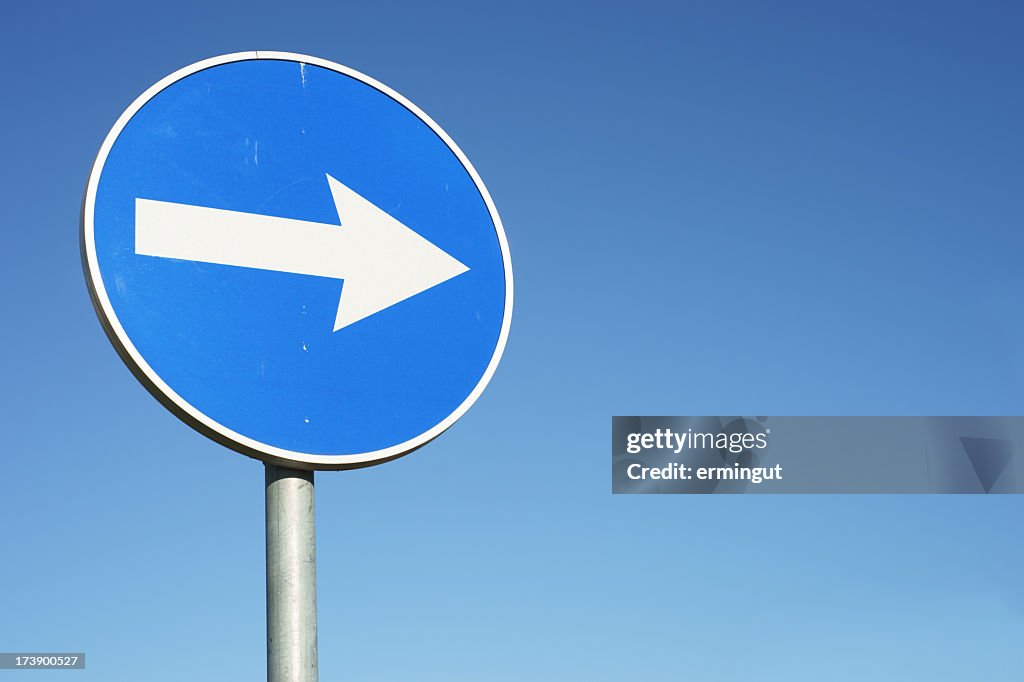 Blue, circular right turn traffic sign