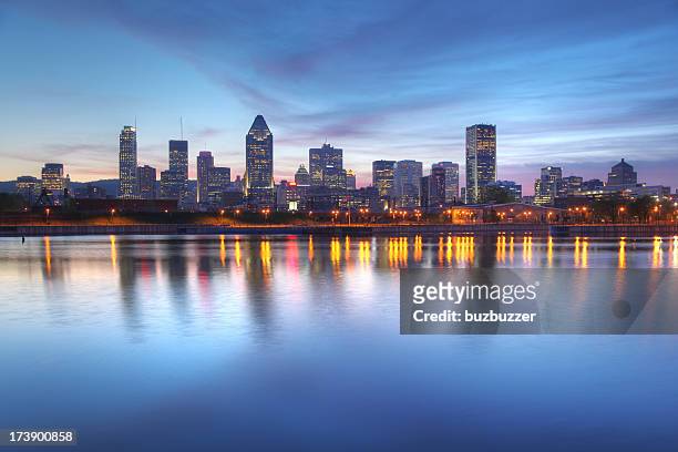 blue evening sky over montreal cityscape - montréal stock pictures, royalty-free photos & images