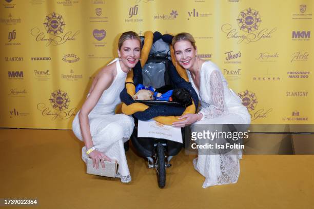 Nina Meise and Julia Meise and dog babys attend the VITA Charity Gala on October 14, 2023 in Wiesbaden, Germany.