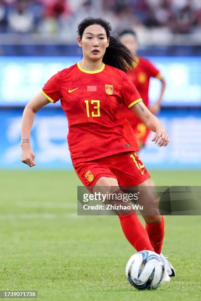 Yang Lina of China controls the ball during the 19th Asian Game Women's bronze medal match between China and Uzbekistan at Huanglong Sports Centre...