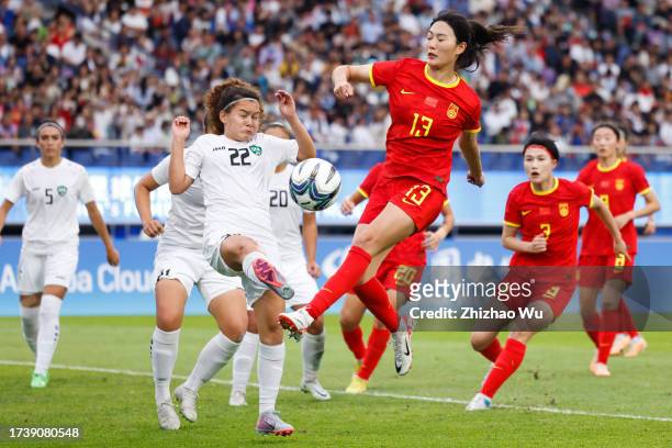 Yang Lina of China competes for the ball during the 19th Asian Game Women's bronze medal match between China and Uzbekistan at Huanglong Sports...