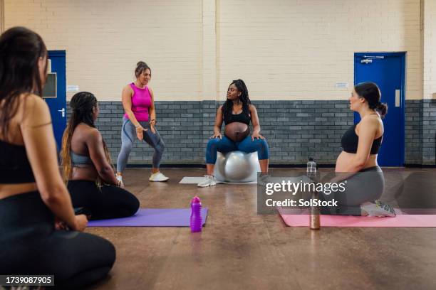 using a fitness ball for stretching - yoga ball work stock pictures, royalty-free photos & images