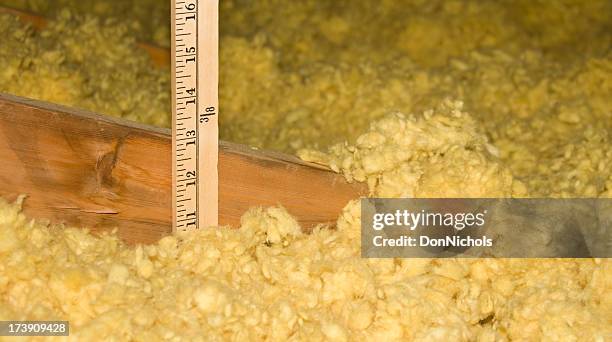 measuring attic insulation - house rules stock pictures, royalty-free photos & images