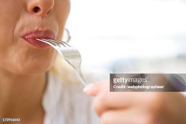 eating - woman mouth stock pictures, royalty-free photos & images