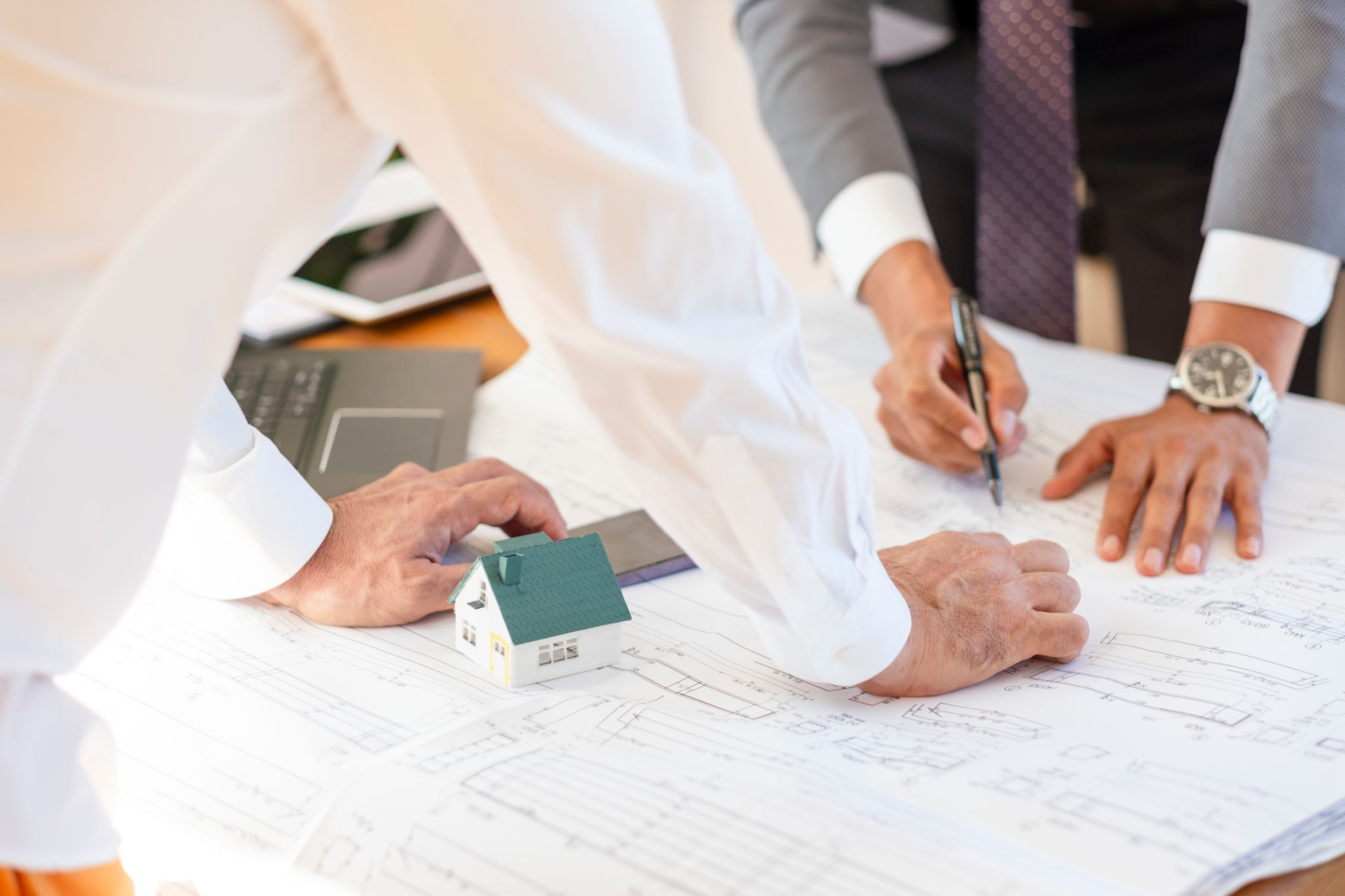 Architect and engineer meeting about architectural plan Architect and engineer meeting about architectural plan