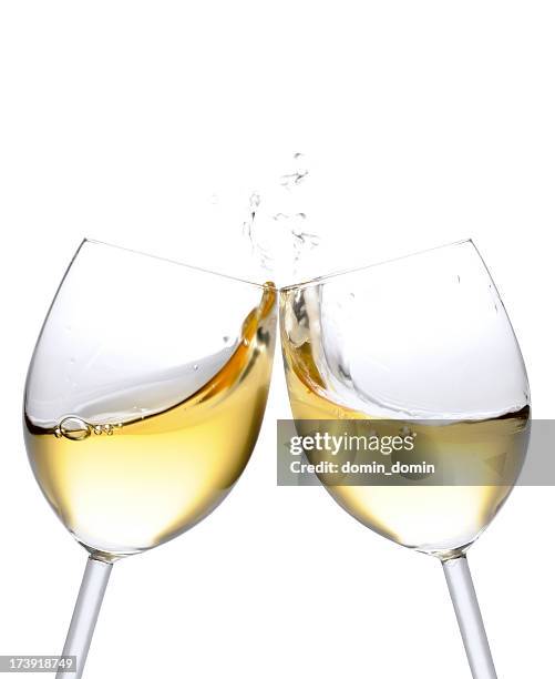 cheers! two white wine glasses with splash, isolated on white - vitt vin bildbanksfoton och bilder