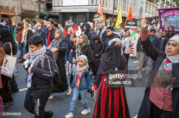 London, UK, Pro-Palestinian Muslim women and children demonstrate in London, UK, against Israeli attacks on Gaza.