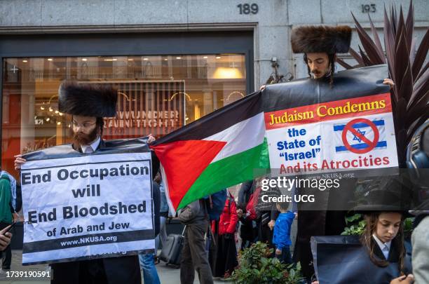 London, UK, Men from the anti-Zionist Haredi Jewish group Neturei Karta, or Guardians of the City, protest in support of Palestine and against...