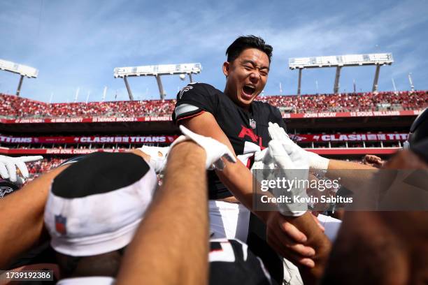 Younghoe Koo of the Atlanta Falcons celebrates with teammates after making a game-winning field goal on the final play of an NFL football game...