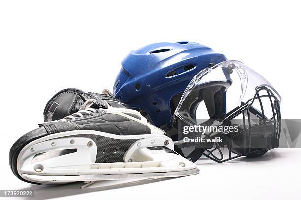 close-up of a hockey helmet and skate - hockey gear stock pictures, royalty-free photos & images