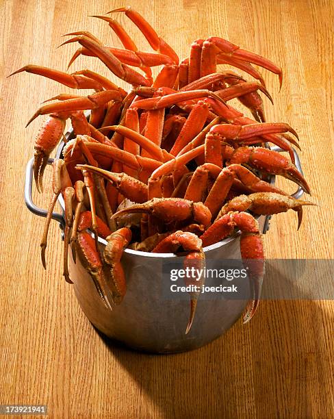 big pot of snow crab - crab leg stock pictures, royalty-free photos & images