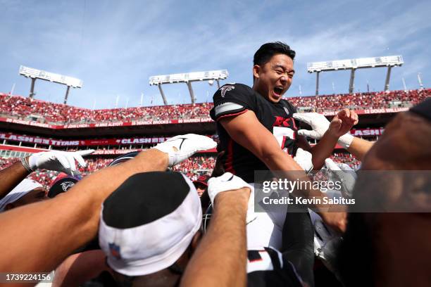 Younghoe Koo of the Atlanta Falcons celebrates with teammates after making a game-winning field goal on the final play of an NFL football game...