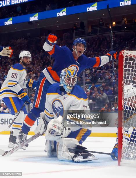 Pierre Engvall of the New York Islanders celebrates an Islander goal against Devon Levi Buffalo Sabres at UBS Arena on October 14, 2023 in Elmont,...