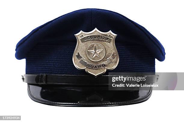 hat with security guard badge - police in riot gear stockfoto's en -beelden