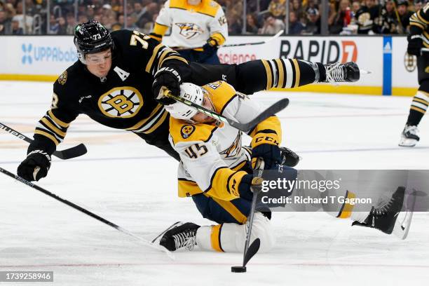 Charlie McAvoy of the Boston Bruins collides with Alexandre Carrier of the Nashville Predators during the second period at the TD Garden on October...