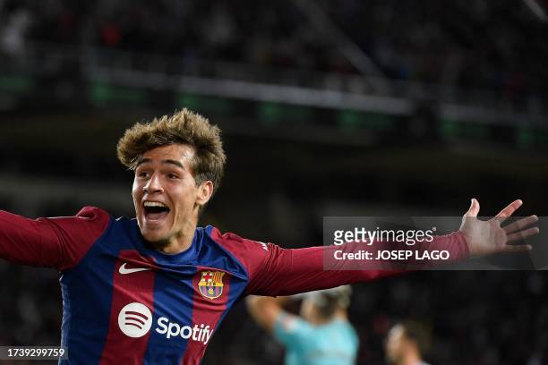 Barcelona's Spanish forward Marc Guiu celebrates after scoring his team's first goal during the Spanish league football match between FC Barcelona...