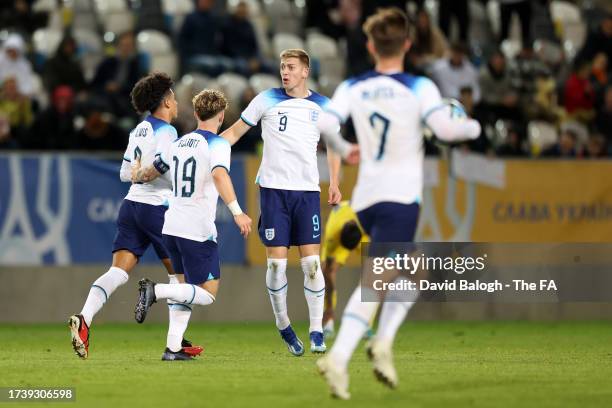 Rico Lewis, Harvey Elliott and Liam Delap celebrate after Noni Madueke of England scored their sides first goal during the Ukraine U-21 v England...