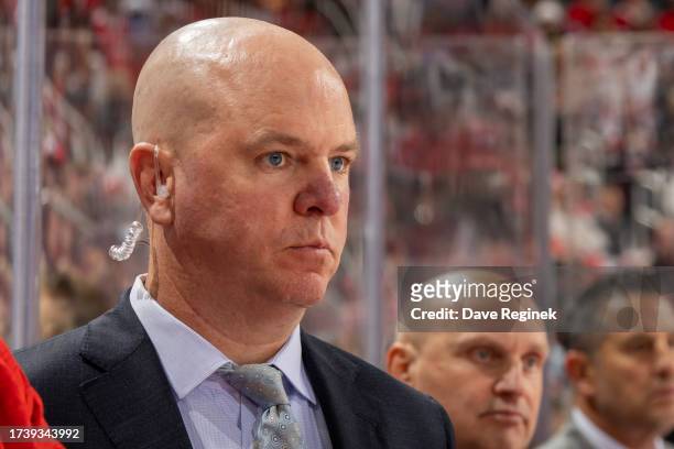 Assistant coach Alex Tanguay of the Detroit Red Wings watches the action from the bench in the first period of the home opener against the Tampa Bay...